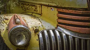 Close-up of the headlight and grill of a rusty old car Close-up of the headlight and grill of a rusty old car