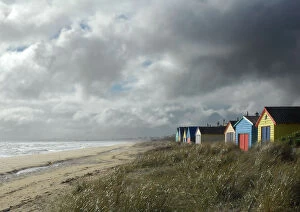 Barbara Fischer Collection: Clouds over beach with huts