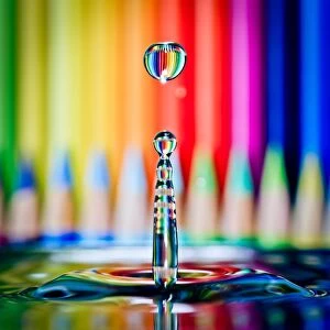 Images Dated 4th March 2015: Colored pencils refracted in waterdrop