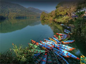 Colourful hire boats tied up on the shoreline of Lake Pokhara, Nepal Colourful hire boats tied up on the shoreline of Lake Pokhara, Nepal