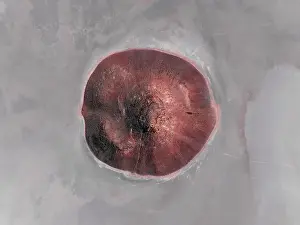 Images Dated 22nd April 2024: Cone shaped rock formation in the middle of a dry salt lake photographed from a drone point of view