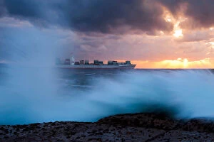 Images Dated 17th April 2009: Container Ship sailing in to the Sunrise