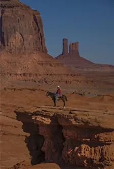 Arizona Prints: A cowboy poses at Monument Valley, Arizona