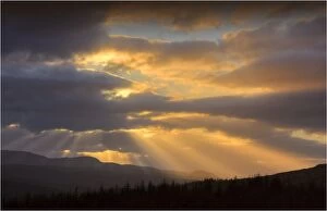 Images Dated 29th June 2013: Dawn rays light up the sky over Loch Duich in the highlands of Scotland