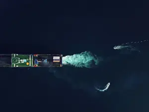 Majestic Marvels: Australia's Container Ship Prints: Directly above view of two pilot boats commanding a RoRo cargo ship into the harbour