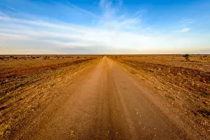 Dirt road crossing Mundi Mundi Plains in New South Wales