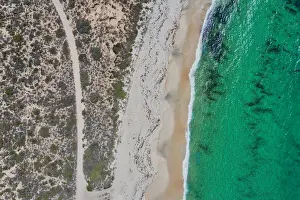 Dirt road to a nice sandy beach - Aerial view