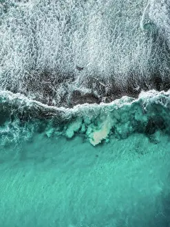 Images Dated 2023 August: Drone photo showing Ocean waves breaking over an exposed rock formation