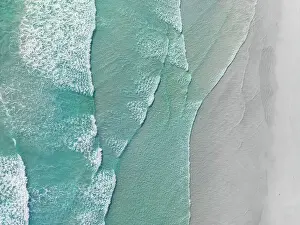 Drone photo showing waves from the Southern Ocean washing onto a beach, Lucky Bay, Esperance, Western Australia, Australia