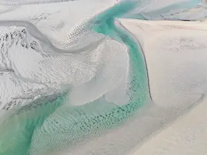 Abstract Aerial Art Prints: Drone shot showing a water channel flowing in Willie Creek estuary at low tide