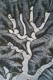 Drone shot of twisting field patterns in the mountains, Aragon, Spain