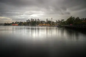 Dust at Mort Bay with Sydney skyline