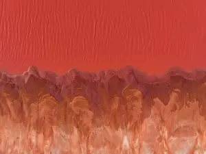Images Dated 13th July 2023: The edge of a vibrant coloured salt lake photographed from a drone point of view