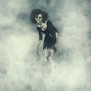 Donald Iain Smith Collection: Female Zombie with glowing eyes emerging from fog