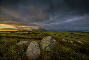 The first light of dawn appears over the Strzelecki Range from Wireless hill, Flinders Island, Bass Strait, Tasmania