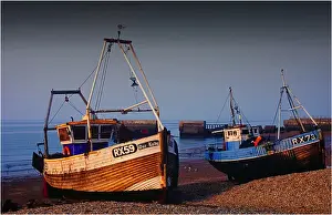 Trawler Prints: Fishing Trawlers, beached at low tide at Hastings, Kent, England