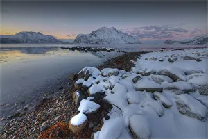 Flakstadoya region along the coastline at first light of a winters morning Flakstadoya region along the coastline at first light of a winters morning