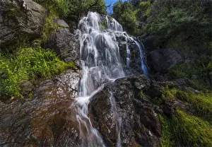 Flowing water over Falls Creek waterfall in the Alpine mountainous region of north east Victoria, Australia
