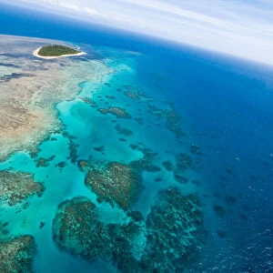 Great Barrier Reef Collection: Flying over green island