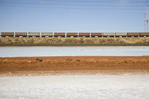 Freight train moving through a barren landscape, Port Hedland, Western Australia, Australia