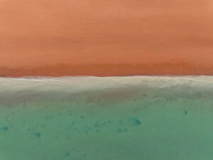 Abstract Aerial Art Collection: Gentle waves rolling onto Simpson Beach from the Indian Ocean photographed from a drone point of