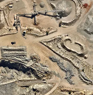 <b class=qtipBold><figcaption>Gravel Quarry Aerial View</figcaption></b><br>Gravel quarry from above with equipment<br><em>© This content is subject to copyright.</em> Gravel Quarry Aerial View