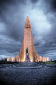 Mariusz Kluzniak Prints: Hallgrimskirkja church lit at cloudy dusk