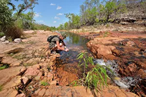 Images Dated 1st November 2019: Hiker at the waters edge