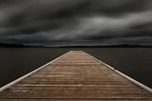 Kathryn Diehm Collection: jetty out onto the lake with dark moody clouds