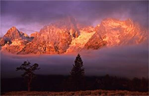 Images Dated 29th July 2013: The kiss of dawn sunlight over the mountains in the Grand Teton National Park, Wyoming