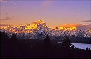 Images Dated 29th July 2013: The kiss of dawn sunlight over the mountains in the Grand Teton National Park, Wyoming