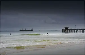 Large container ship entering Port Phillip bay on a cold bleak winter morning, Victoria