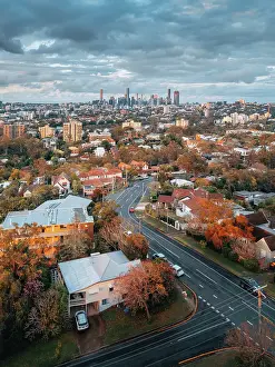 Prints of It was a cloudy late afternoon. Brisbane River meandered through the city. The late afternoon sunlight shrouded everything in gold Queensland (QLD) Prints: Late Afternoon View of Brisbane CBD From West Suburb