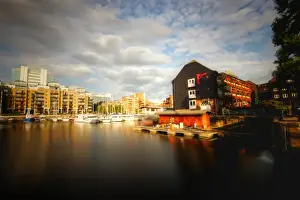 Mariusz Kluzniak Prints: London St Katherines Dock marina with historic buildings and docked boats in long exposure