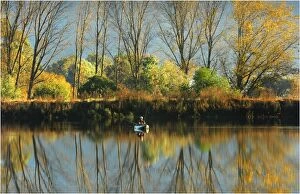 Images Dated 23rd April 2011: Lone fisherman with reflections of the Autumn, near Mount Beauty, in the high country of Victoria