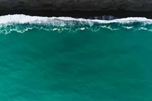 Ocean Wave Aerials Collection: Looking down at black sand beach