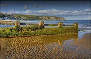 Low tide in the seaside village of Swanage, on the Jurassic coastline of Dorset, England , United Kingdom Low tide in the seaside village of Swanage, on the Jurassic coastline of Dorset, England , United Kingdom