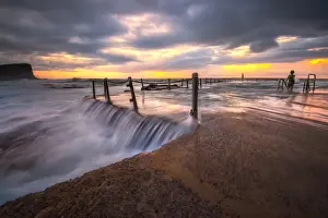 Magnificent sunrise and stunning colour over Avalon rock pool