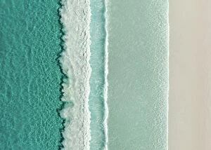 Aerial Beach Photography Collection: Majestic drone image looking down on rows of Ocean waves rolling onto an idyllic beach, Lucky Bay