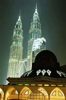John W Banagan Collection: Malaysia, Kuala Lumpur, Petronas Towers, mosque in foreground, night