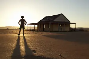Getting Away From It All Prints: man in front of outback shed
