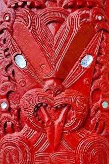 Maori tekoteko carving with paua shell decoration