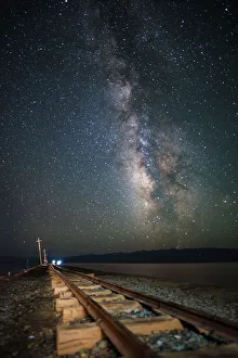 Milky way and mining railway track in Chaka Salt Lake on Qinghai-Tibetan Plateau, China Milky way and mining railway track in Chaka Salt Lake on Qinghai-Tibetan Plateau, China