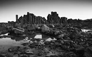 Images Dated 31st August 2019: Monochrome, Dramatic coastal basalt columns rock formations at sunset at the disused