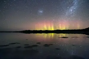 Natures Fireworks, bright beams of the Aurora Australis reflected in water