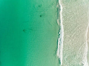 Ocean Wave Aerials Collection: Ocean wave rolling onto beach