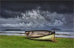 Old and derelict Lighter boats, once used to ferry commercial goods to shore from freighter ships, sit on the kingston foreshore, Norfolk Island