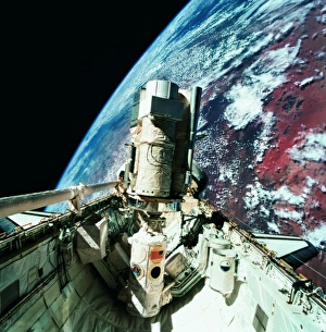 The open cargo bay of the space shuttle orbiting above earth The open cargo bay of the space shuttle orbiting above earth