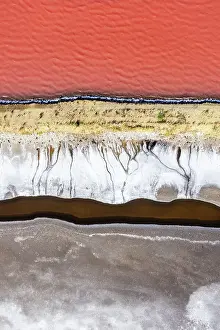 Images Dated 2023 August: Overhead photo showing the shoreline of a vibrant coloured salt lake