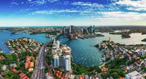 Panorama Aerial view Scene of Crowded Traffic over Express way heading to Sydney Harbour Bridge with Opera House, Lavender bay with many Yacht and Circular Quay